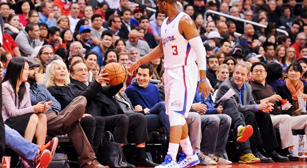 Chris Paul (center) has spent two seasons playing for Clippers owner Donald Sterling. (Noah Graham/Getty Images)