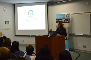 Edith Lara-Trad, information officer at Covered California, welcomes representatives from Inland community groups to the first Covered California regional meeting at Loma Linda University Health.