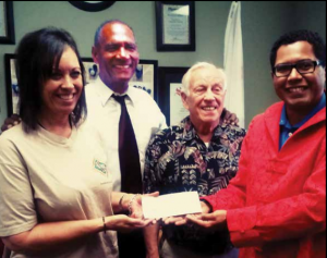 SafeCare Financial Services delivers on its pledge of $5000.00 and extends a challenge to other IE businesses to do the same. (L to R) Leilani Palmer, Excutive Director of YouthPower Solutions I E Youth Build Program; Wallace J. Allen, Host ETB; Reverend Jim Peterson, SafeCare Director; and Andrew Valles, SafeCare CEO and ETB Co-host.  