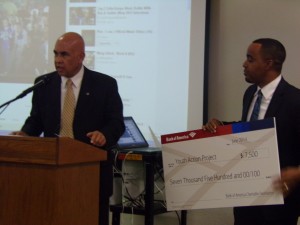 Joesph Williams being presented with a from Bank of America 