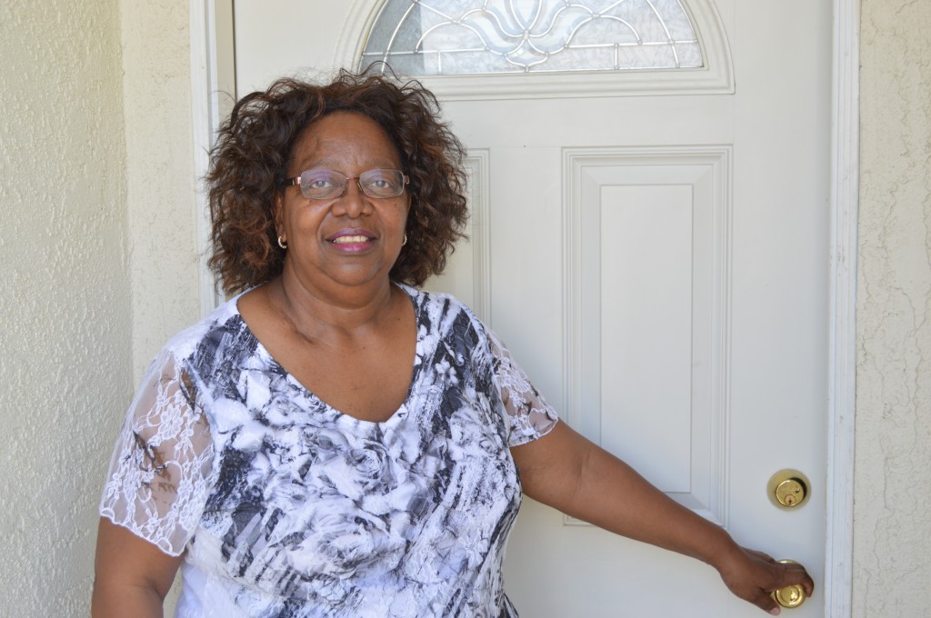 Ms. Carolyn in front of her new home