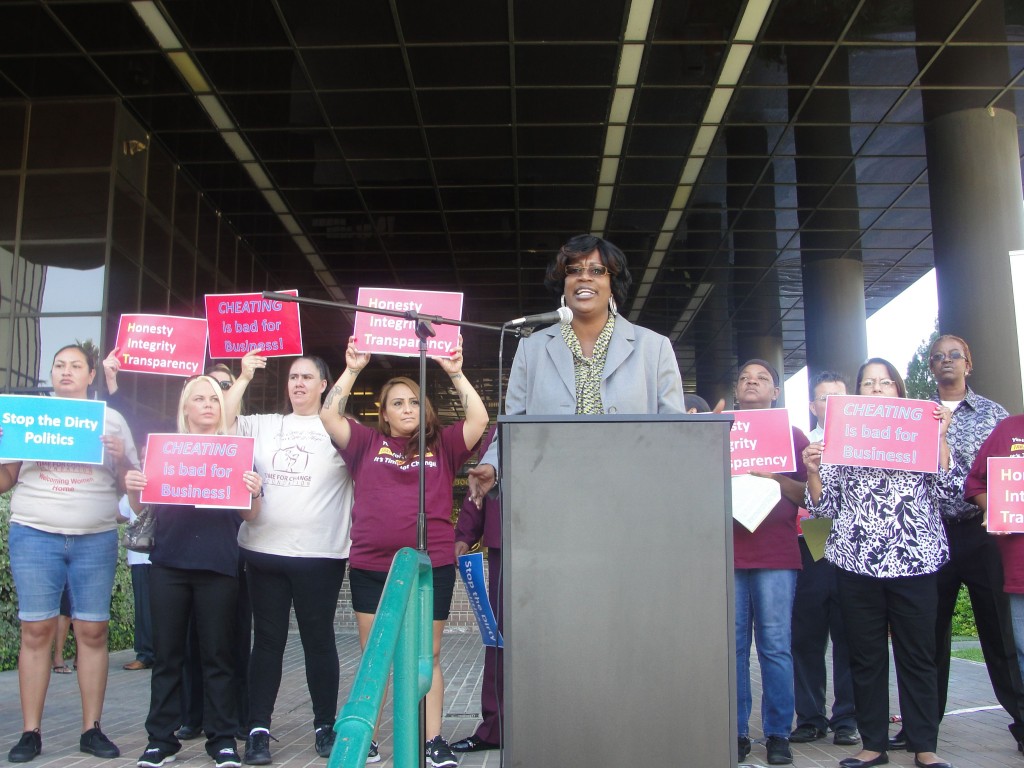 Kim Carter, CEO of Time For Change Foundation, speaks at the Monday morning protest that the foundation held on the steps of city hall. 