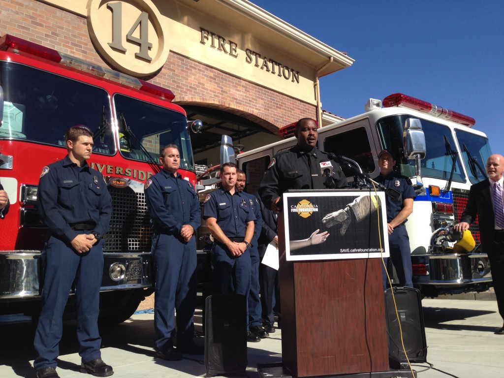 Riverside Fire Chief Michael Moore, flanked by firefighters from his city and Rancho Cucamonga at Riverside Fire Station 14, announces Riverside’s participation in Supplying Aid to Victims of Emergency (SAVE), which provides immediate short-term relief to fire and disaster victims.