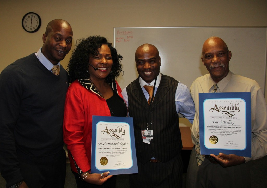 Jonathan Buffong, Facilitator, IE NPRDC;   Jewel Diamond Taylor, (2nd from the left), & Frank Kelly, (3rd from the left), receive a "Certificate of Commendaion" from Assembly Member, Cheryl Brown;   & Terrance Stone, CoChair, IE NPRDC.