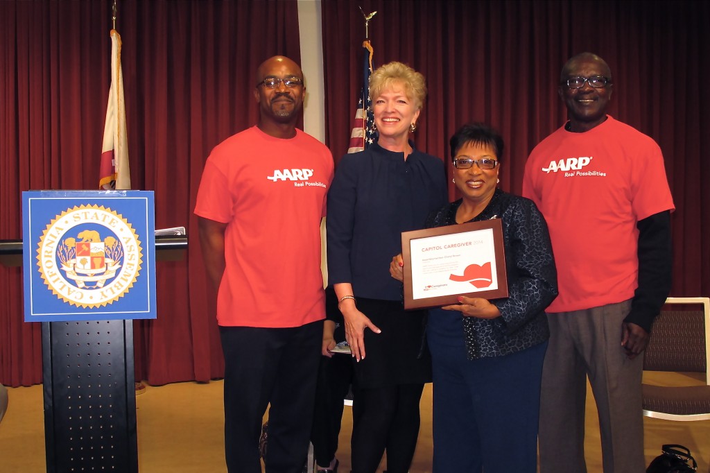 (L to R) Sam Appiah-Kubi (AARP staff), Nancy McPherson (AARP Interim State Pres.), Assemblymemer Brown, and Antoine Cook (AARP staff). Photo by Jon Gaede