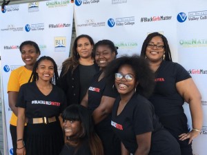 Panelist Zumar Zamaan (back center) pictured with students who work closely with Dina Walker