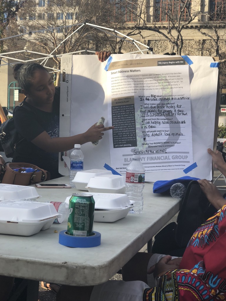 Genesis presents her business plan to a panel of mock investors at the 3rd Annual Black History Expo in San Bernardino. Her business is currently up and running. (Photo credit: Naomi K. Bonman)